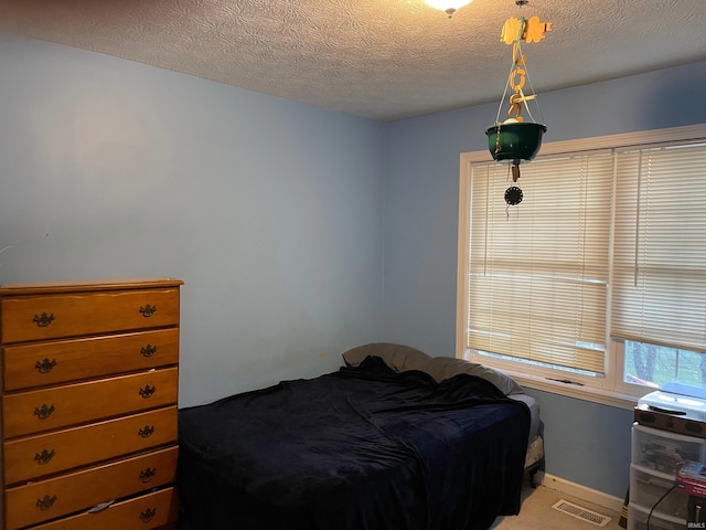 bedroom with a textured ceiling