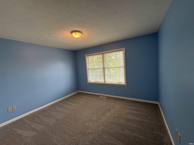 2609 S Isabel Ct, Bloomington, IN 47403 - empty room with carpet flooring, baseboards, and a textured ceiling