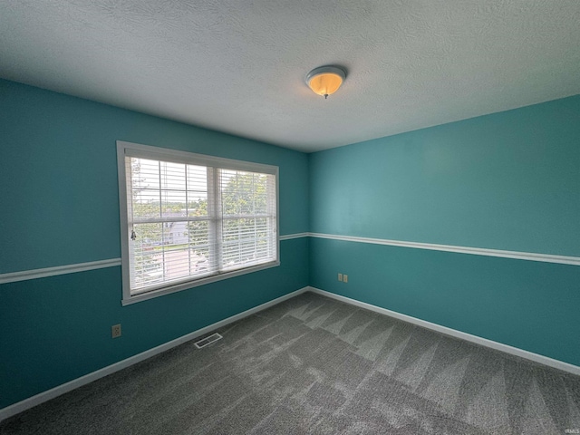 2609 S Isabel Ct, Bloomington, IN 47403 - empty room featuring carpet floors, a textured ceiling, and baseboards