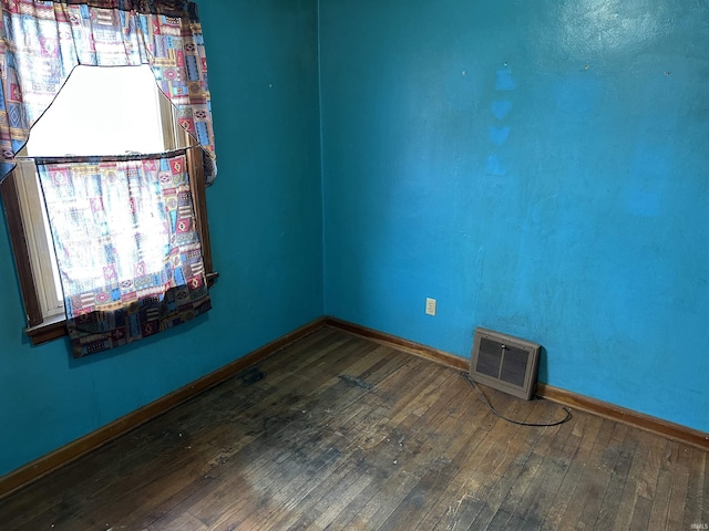 unfurnished room featuring hardwood / wood-style floors