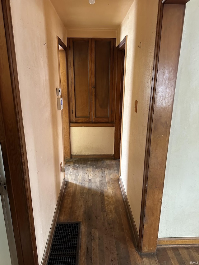 hallway featuring dark wood-type flooring