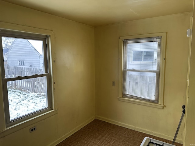 empty room featuring dark parquet flooring