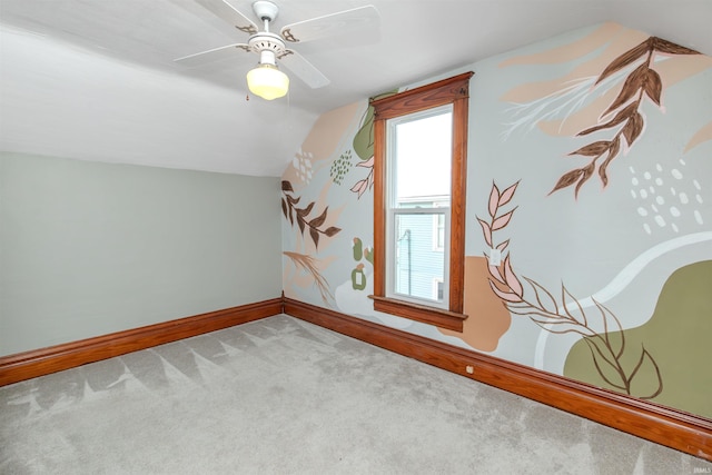 additional living space with carpet flooring, ceiling fan, and lofted ceiling