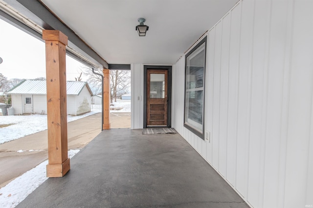 view of snow covered property entrance