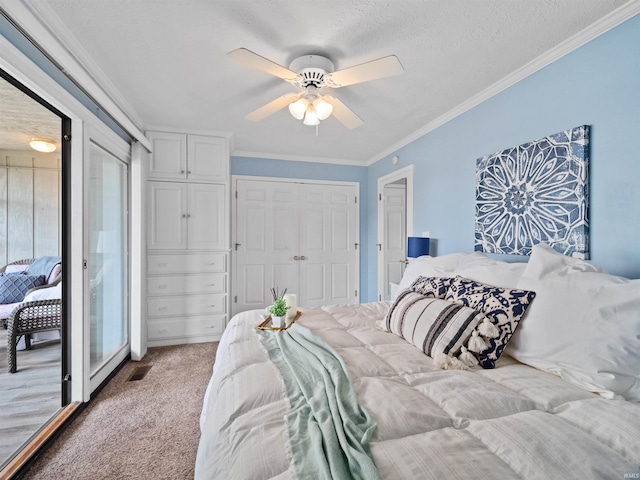 bedroom featuring a textured ceiling, light colored carpet, ceiling fan, and crown molding