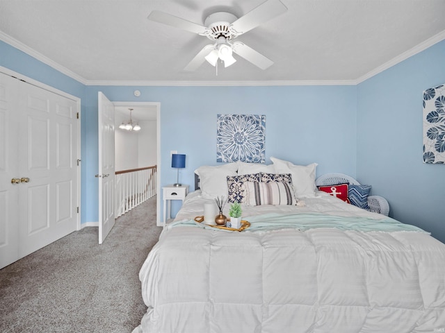 carpeted bedroom featuring ceiling fan with notable chandelier and ornamental molding