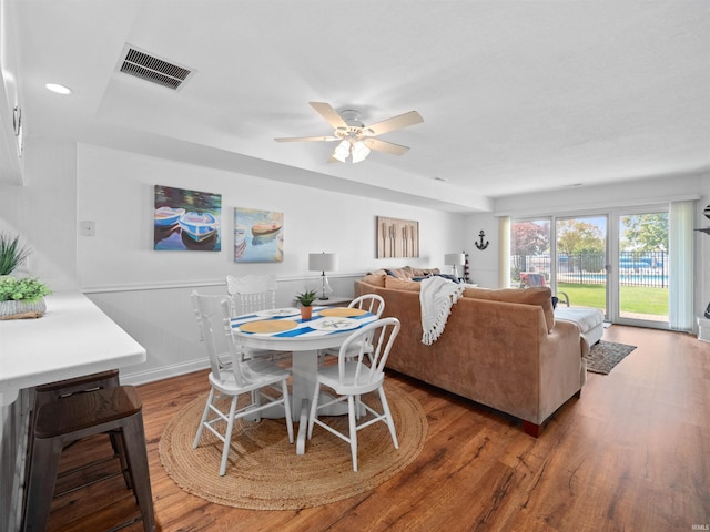 dining space featuring hardwood / wood-style floors and ceiling fan