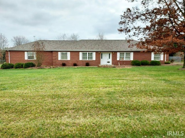 ranch-style house featuring a front lawn