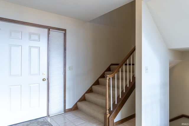 foyer entrance with light tile patterned floors