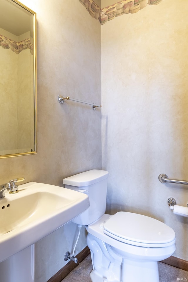 bathroom with sink and toilet