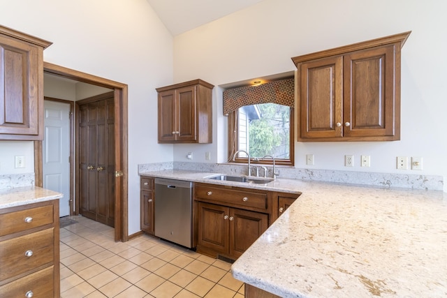 kitchen with high vaulted ceiling, sink, stainless steel dishwasher, light stone countertops, and light tile patterned floors