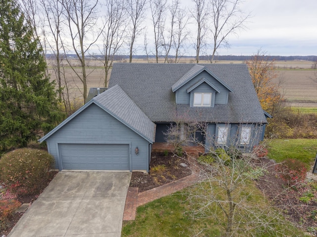 view of front of home featuring a rural view and a garage