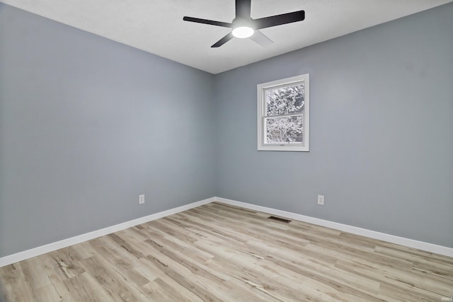 spare room featuring ceiling fan and light wood-type flooring