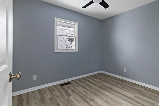 empty room featuring ceiling fan and light wood-type flooring