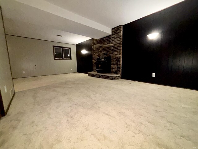 basement featuring a wood stove