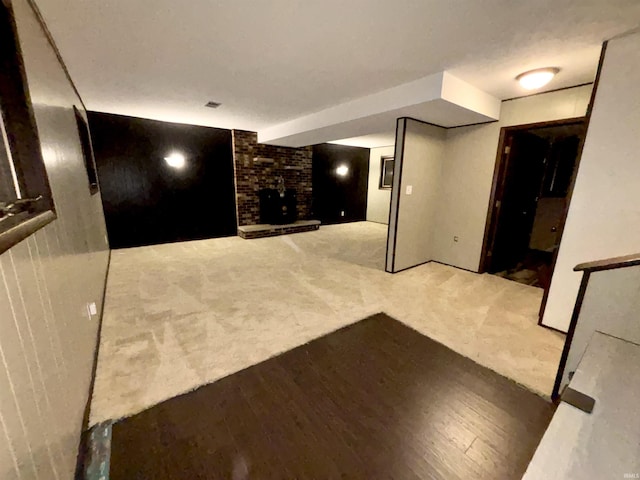 interior space with carpet flooring and a fireplace