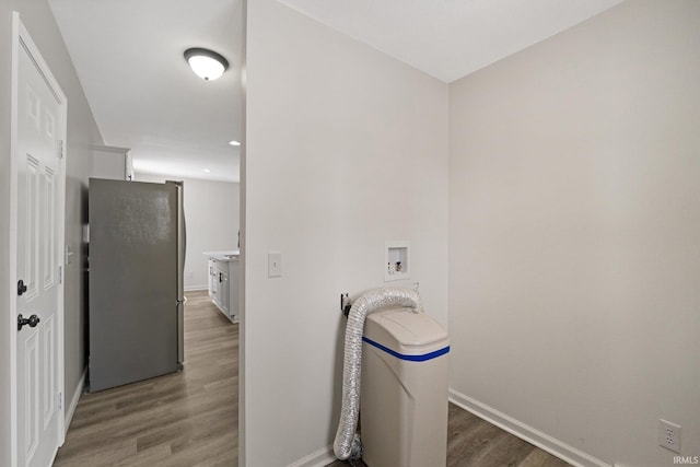 laundry room featuring wood-type flooring and washer hookup