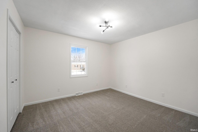 unfurnished bedroom with a closet and carpet floors