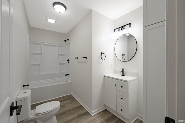 full bathroom featuring shower / washtub combination, toilet, vanity, and hardwood / wood-style flooring