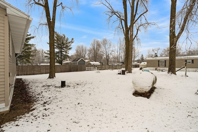 view of yard layered in snow