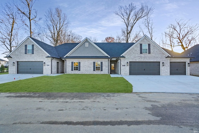 view of front of home featuring a garage and a front lawn