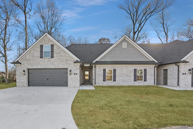 view of front of home featuring a garage and a front yard