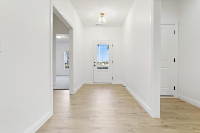 entryway with light hardwood / wood-style flooring