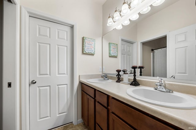 bathroom with vanity and tile patterned floors