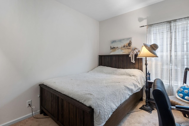 bedroom featuring light colored carpet