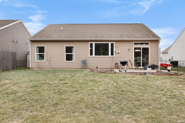 rear view of house with a patio area, a yard, and cooling unit