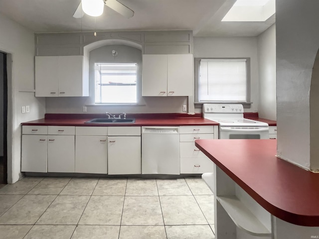 kitchen featuring ceiling fan, sink, light tile patterned floors, white appliances, and white cabinets