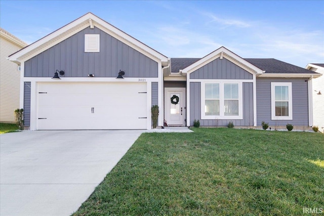 view of front facade with a garage and a front lawn