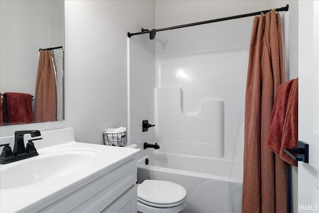 full bathroom featuring vanity, shower / bathtub combination, and toilet