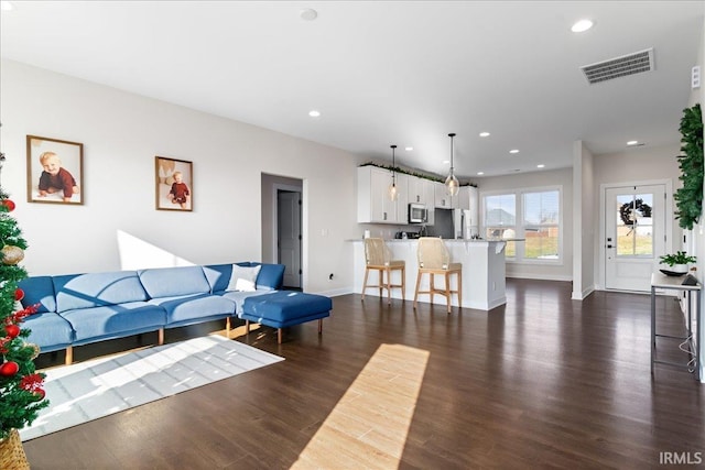 living room featuring dark hardwood / wood-style floors