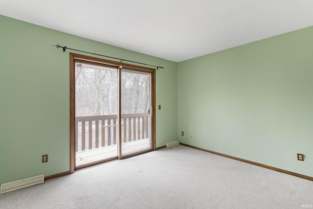 empty room featuring carpet floors