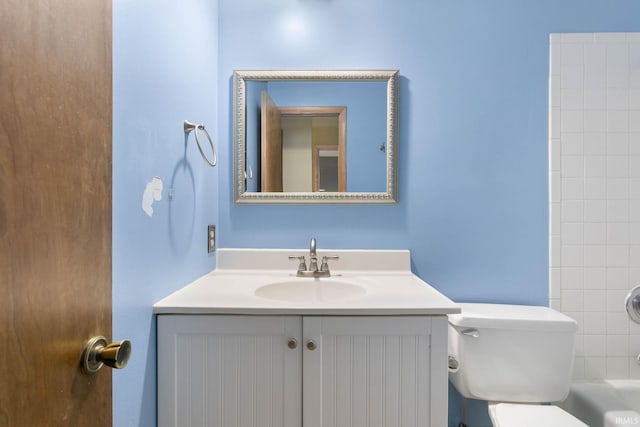 bathroom featuring vanity and toilet