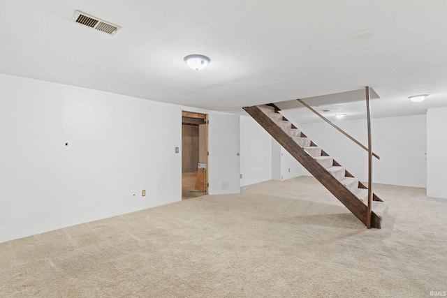 basement with light carpet