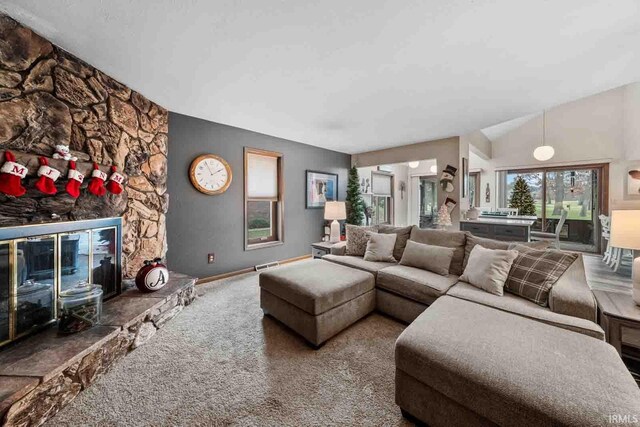 living room with a fireplace and carpet