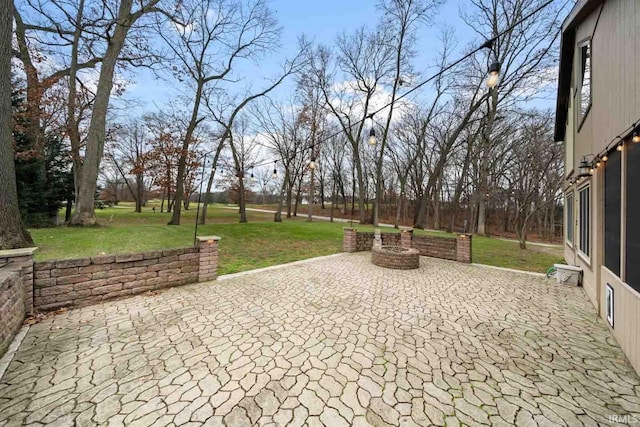 view of patio with an outdoor fire pit