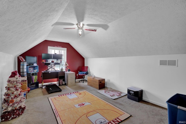 additional living space with a textured ceiling, ceiling fan, lofted ceiling, and light carpet