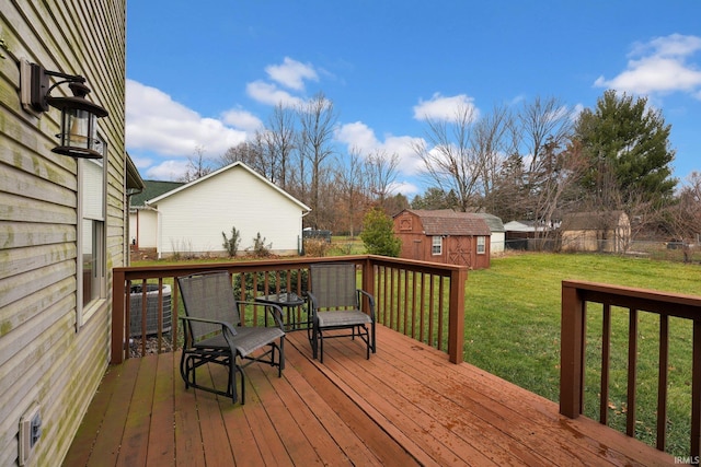 deck featuring a lawn, central air condition unit, and a storage shed