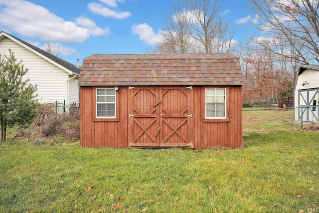 view of outdoor structure featuring a lawn