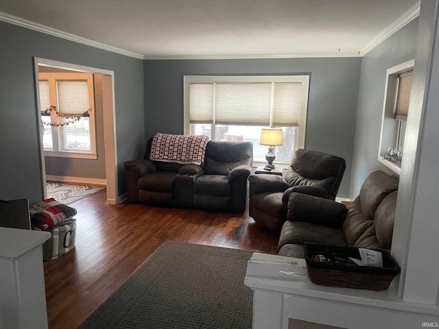 living room featuring crown molding, plenty of natural light, and dark hardwood / wood-style floors