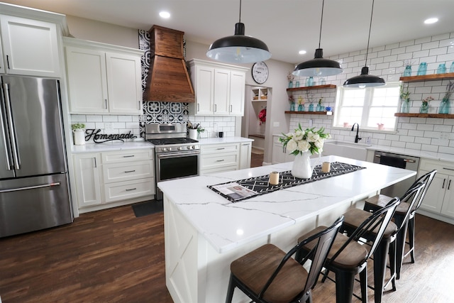 kitchen featuring sink, white cabinetry, and stainless steel appliances