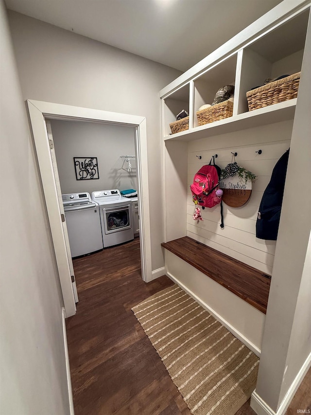 mudroom with separate washer and dryer and dark hardwood / wood-style flooring