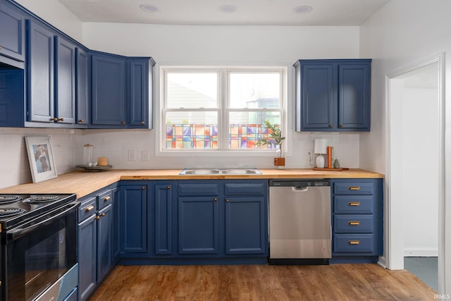 kitchen with dishwasher, sink, dark hardwood / wood-style floors, blue cabinetry, and butcher block countertops