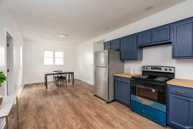 kitchen with stainless steel fridge, range with electric stovetop, light hardwood / wood-style floors, and blue cabinetry