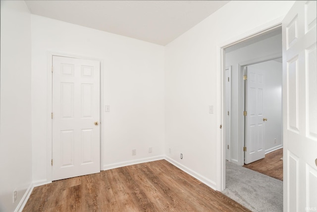 spare room featuring hardwood / wood-style floors