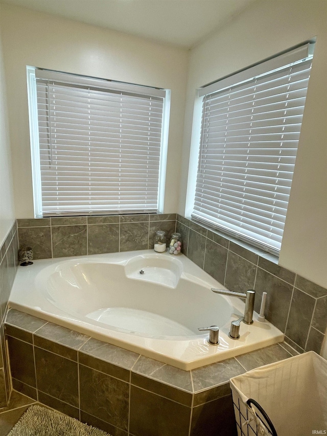 bathroom featuring tiled bath