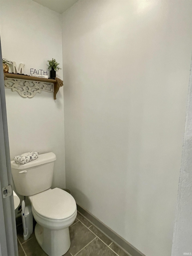 bathroom with tile patterned floors and toilet